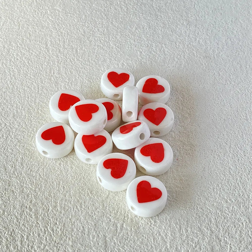 BD00015-01-red-heart-white-coin-ceramic-beads-7x16mm