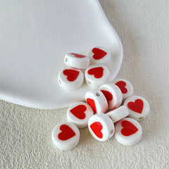 BD00015-02-red-heart-white-coin-ceramic-beads-7x16mm