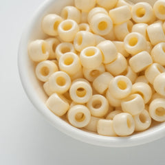 BD00040-02-cream-yellow-barrel-opaque-pony-beads-6×9mm