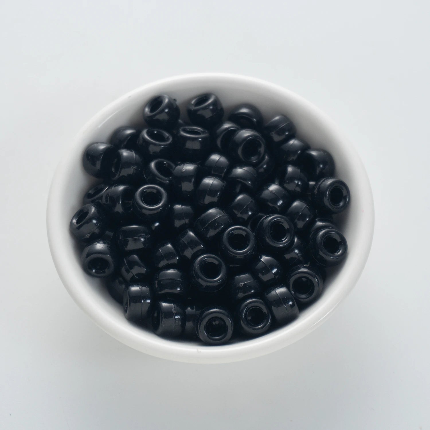 BD00048-01-pure-black-barrel-opaque-pony-beads-6×9mm