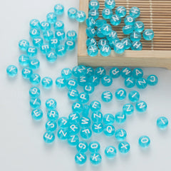 BD00059-05-white-letter-ice-blue-transparent-coin-alphabet-beads-mix-4×7mm