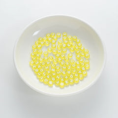 BD00063-01-white-letter-bright-yellow-transparent-coin-alphabet-beads-mix-4×7mm
