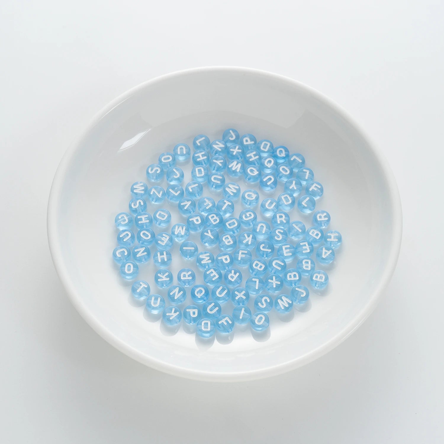 BD00064-01-white-letter-light-blue-transparent-coin-alphabet-beads-mix-4×7mm