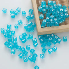 BD00074-05-white-letter-ice-blue-transparent-cube-alphabet-beads-mix-6mm