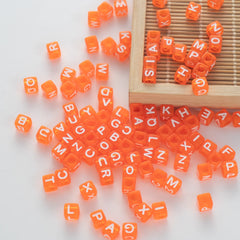 BD00078-05-white-letter-bright-orange-transparent-cube-alphabet-beads-mix-6mm