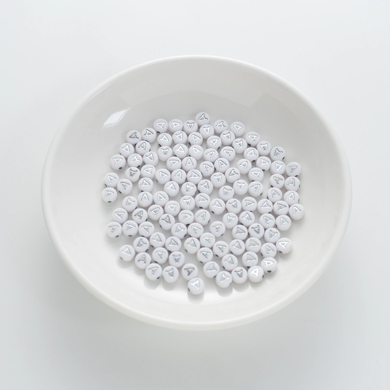 BD00084-01-silver-letter-white-opaque-coin-alphabet-beads-single-a-4×7mm