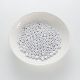 BD00087-01-silver-letter-white-opaque-coin-alphabet-beads-single-d-4×7mm