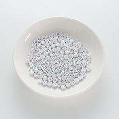 BD00087-01-silver-letter-white-opaque-coin-alphabet-beads-single-d-4×7mm