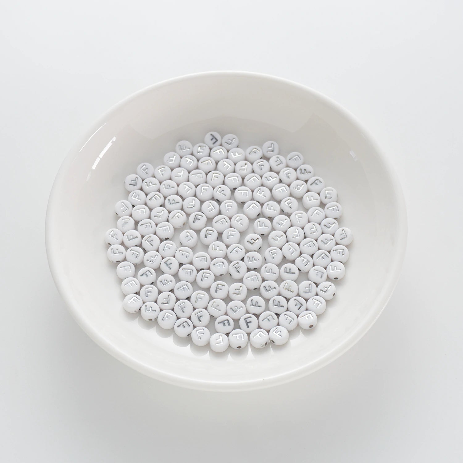 BD00089-01-silver-letter-white-opaque-coin-alphabet-beads-single-f-4×7mm