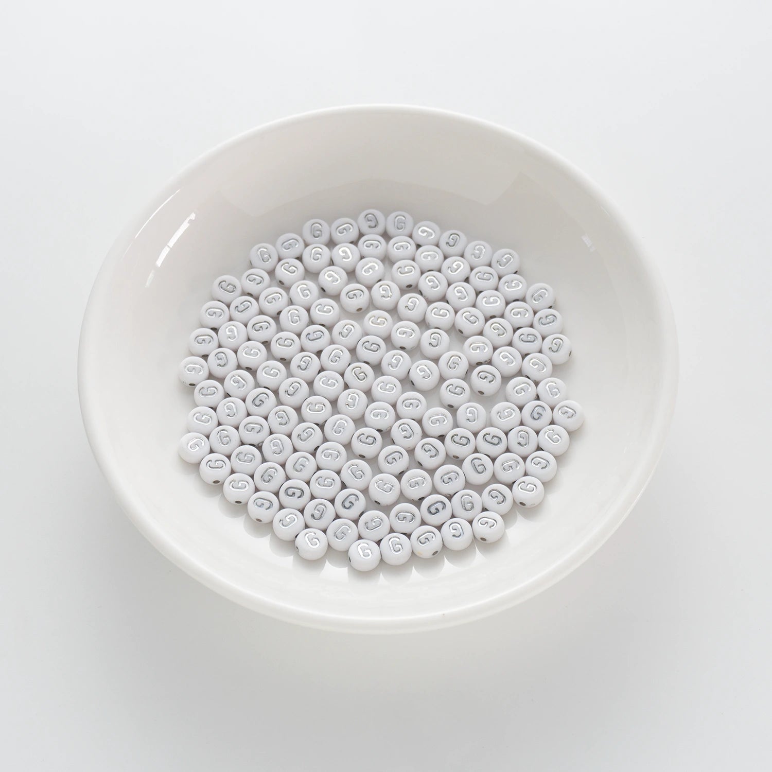 BD00090-01-silver-letter-white-opaque-coin-alphabet-beads-single-g-4×7mm