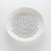 BD00090-01-silver-letter-white-opaque-coin-alphabet-beads-single-g-4×7mm