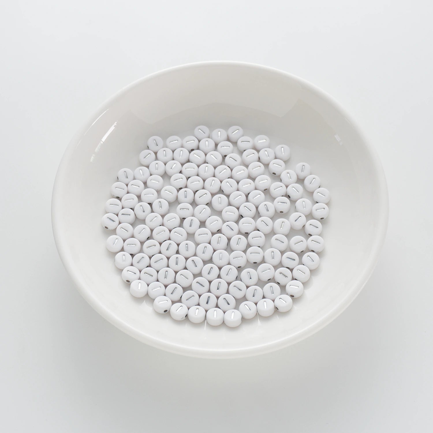 BD00092-01-silver-letter-white-opaque-coin-alphabet-beads-single-i-4×7mm