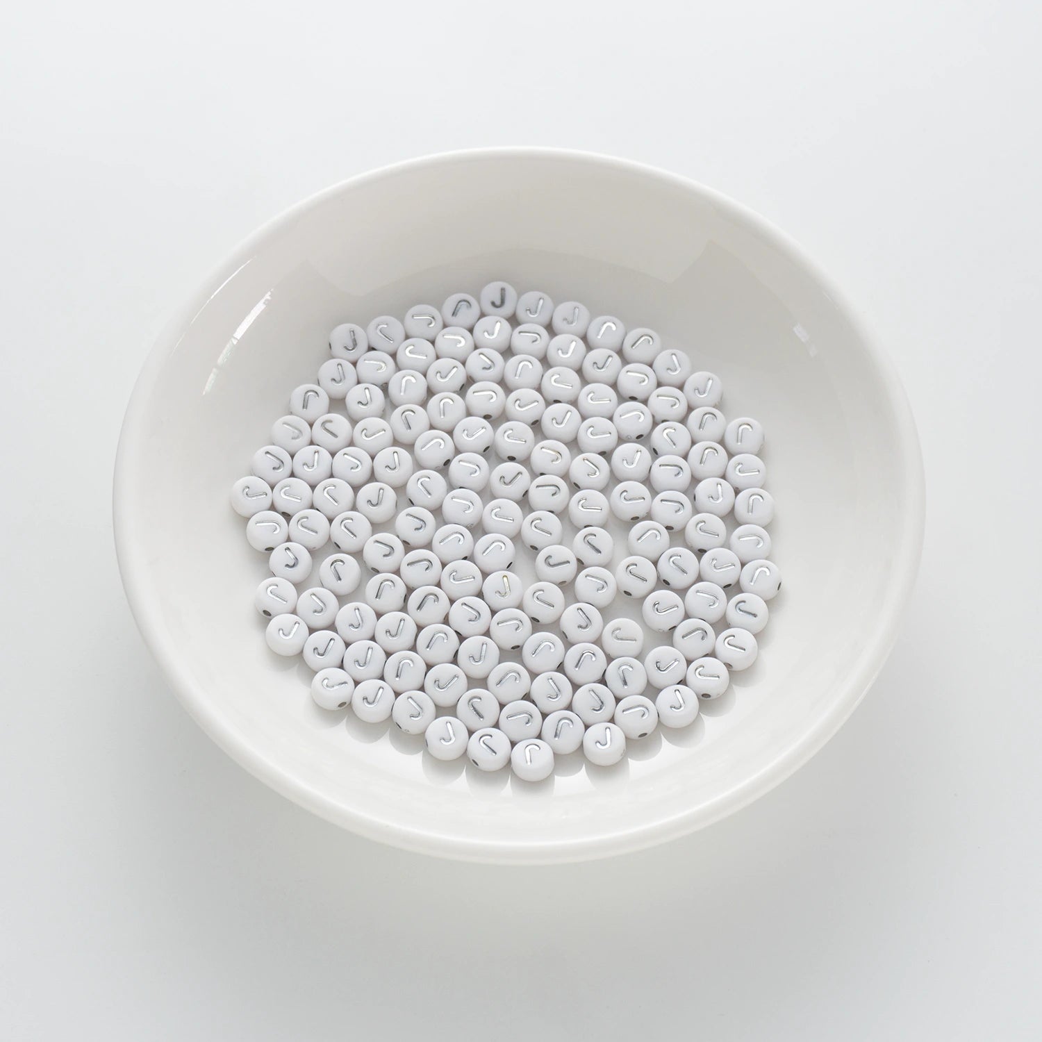 BD00093-01-silver-letter-white-opaque-coin-alphabet-beads-single-j-4×7mm