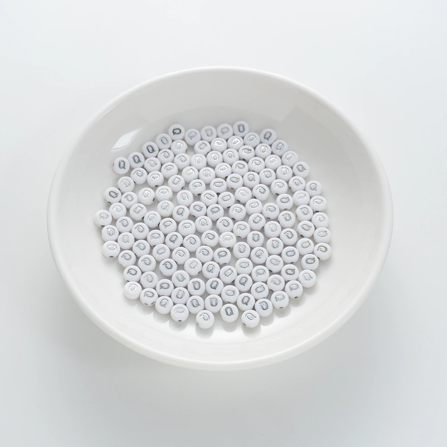 BD00100-01-silver-letter-white-opaque-coin-alphabet-beads-single-q-4×7mm