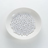 BD00100-01-silver-letter-white-opaque-coin-alphabet-beads-single-q-4×7mm