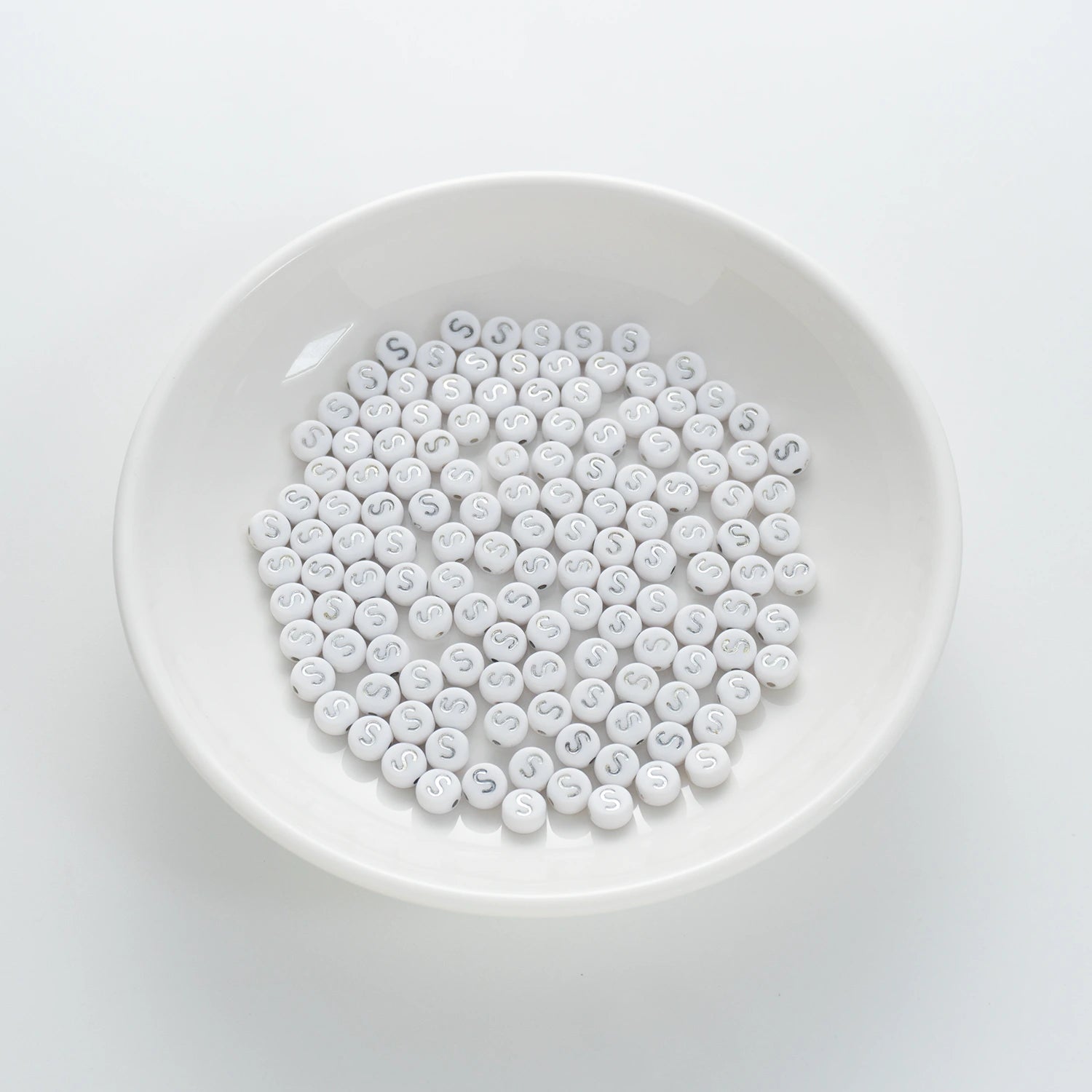 BD00102-01-silver-letter-white-opaque-coin-alphabet-beads-single-s-4×7mm