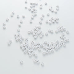 BD00102-04-silver-letter-white-opaque-coin-alphabet-beads-single-s-4×7mm