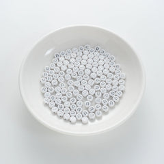 BD00104-01-silver-letter-white-opaque-coin-alphabet-beads-single-u-4×7mm