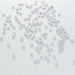 BD00104-04-silver-letter-white-opaque-coin-alphabet-beads-single-u-4×7mm