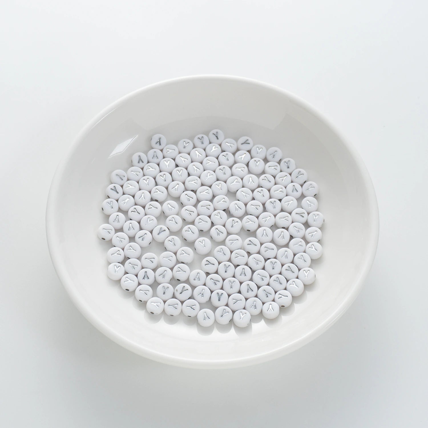 BD00108-01-silver-letter-white-opaque-coin-alphabet-beads-single-y-4×7mm