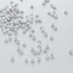 BD00110-04-silver-letter-white-opaque-coin-vowel-alphabet-beads-mix-4×7mm