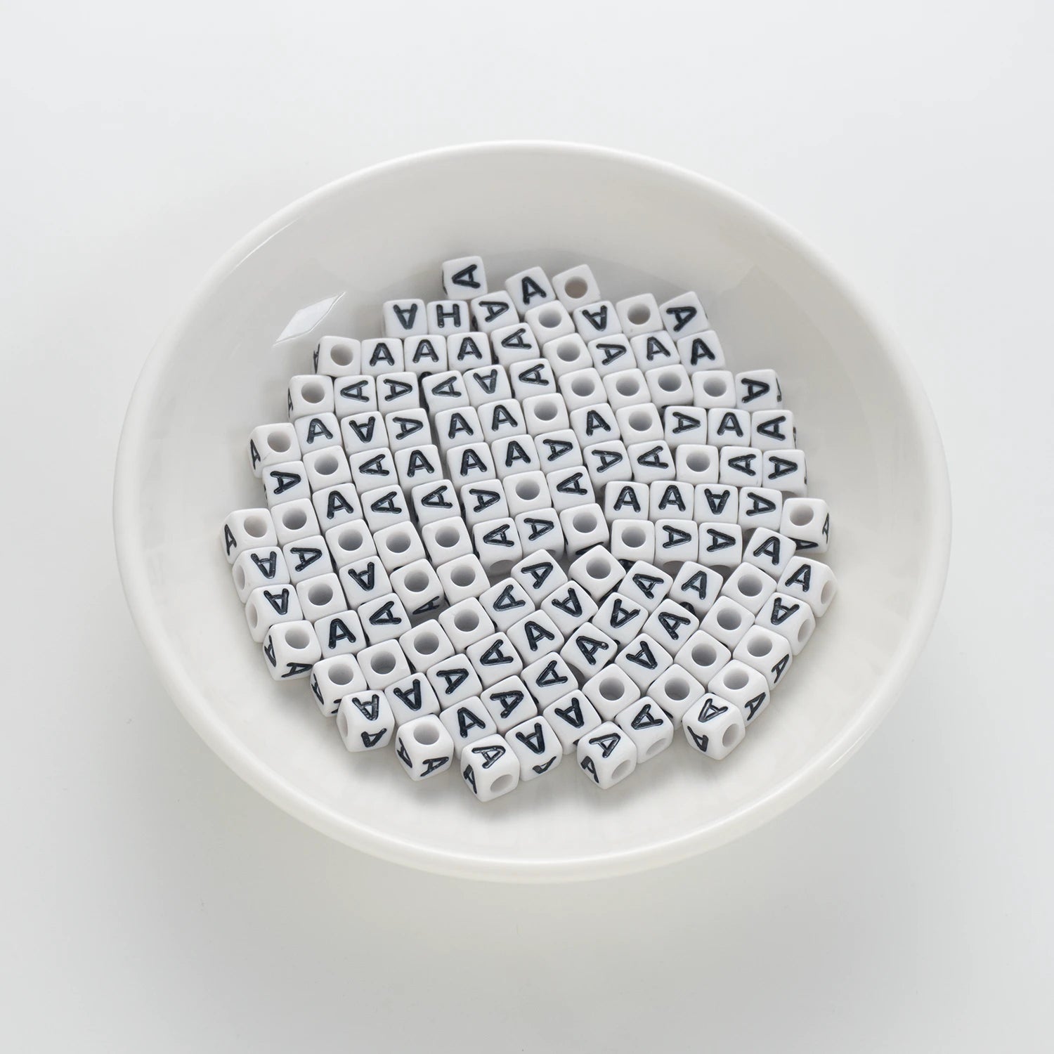 BD00112-01-black-letter-white-opaque-cube-alphabet-beads-single-a-7mm