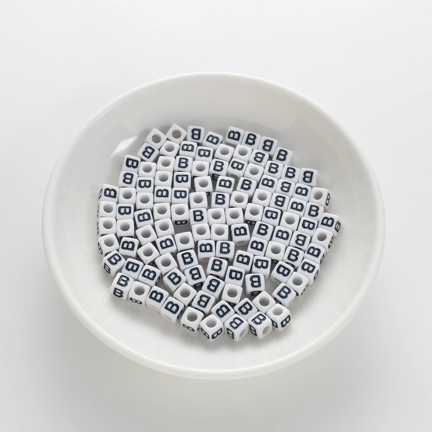 BD00113-01-black-letter-white-opaque-cube-alphabet-beads-single-b-7mm