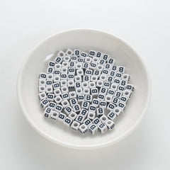 BD00113-01-black-letter-white-opaque-cube-alphabet-beads-single-b-7mm