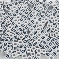 BD00113-02-black-letter-white-opaque-cube-alphabet-beads-single-b-7mm