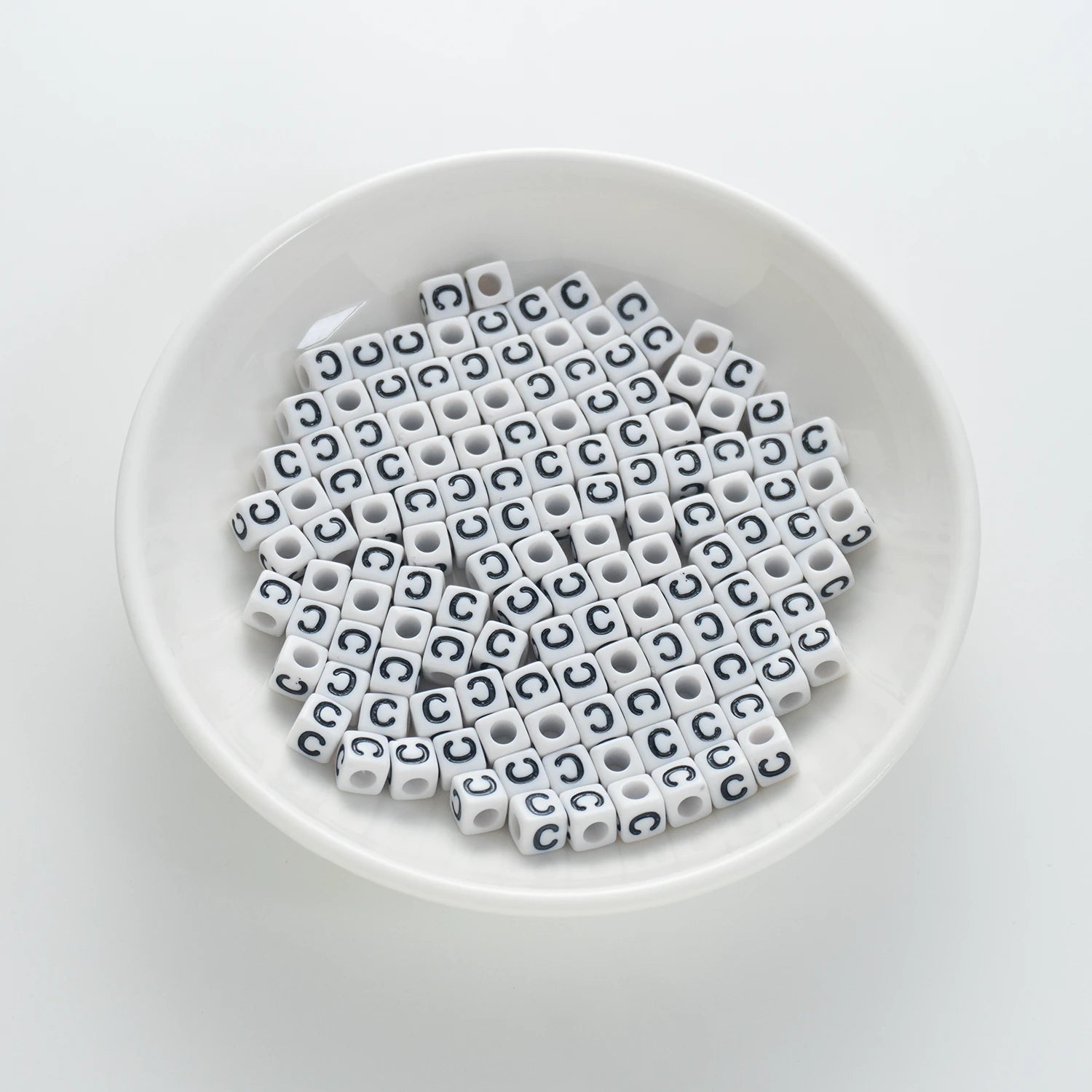 BD00114-01-black-letter-white-opaque-cube-alphabet-beads-single-c-7mm