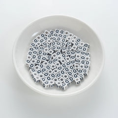 BD00115-01-black-letter-white-opaque-cube-alphabet-beads-single-d-7mm