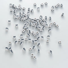 BD00116-03-black-letter-white-opaque-cube-alphabet-beads-single-e-7mm