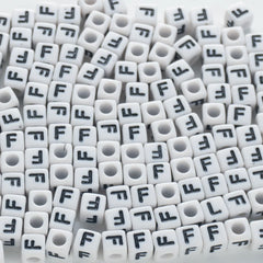 BD00117-02-black-letter-white-opaque-cube-alphabet-beads-single-f-7mm
