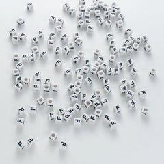BD00117-03-black-letter-white-opaque-cube-alphabet-beads-single-f-7mm