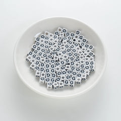 BD00118-01-black-letter-white-opaque-cube-alphabet-beads-single-g-7mm