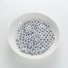 BD00119-01-black-letter-white-opaque-cube-alphabet-beads-single-h-7mm