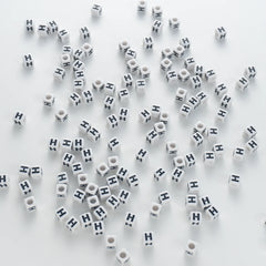 BD00119-03-black-letter-white-opaque-cube-alphabet-beads-single-h-7mm