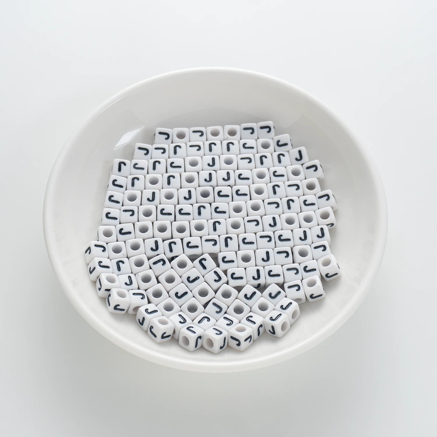 BD00121-01-black-letter-white-opaque-cube-alphabet-beads-single-j-7mm