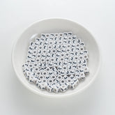 BD00121-01-black-letter-white-opaque-cube-alphabet-beads-single-j-7mm