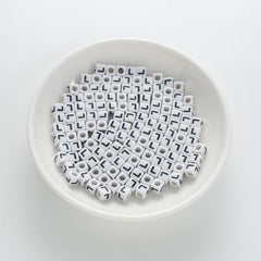 BD00123-01-black-letter-white-opaque-cube-alphabet-beads-single-l-7mm