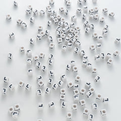 BD00123-03-black-letter-white-opaque-cube-alphabet-beads-single-l-7mm