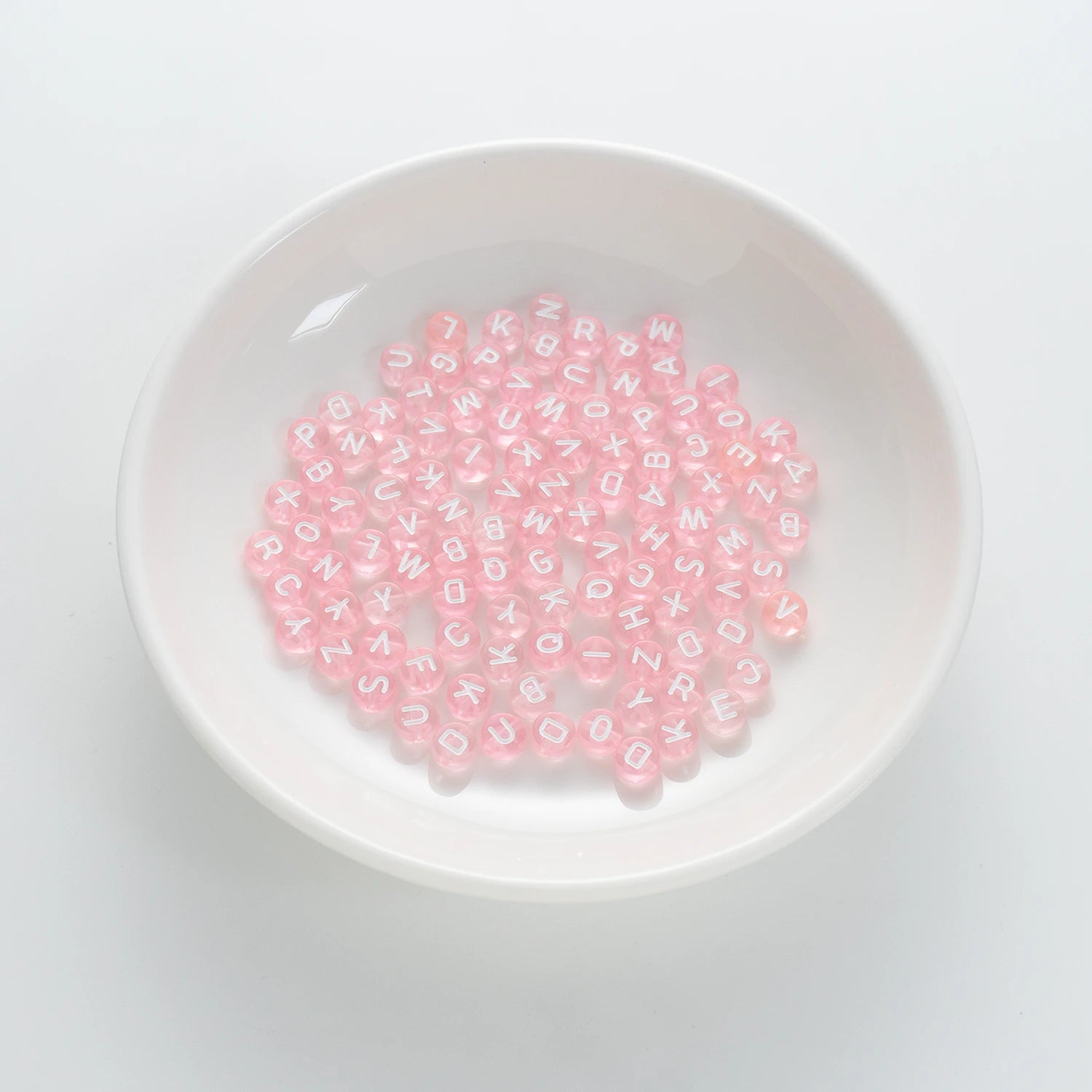 BW-00061-BD-01-white-letter-pastel-pink-transparent-coin-alphabet-beads-mix-4×7mm