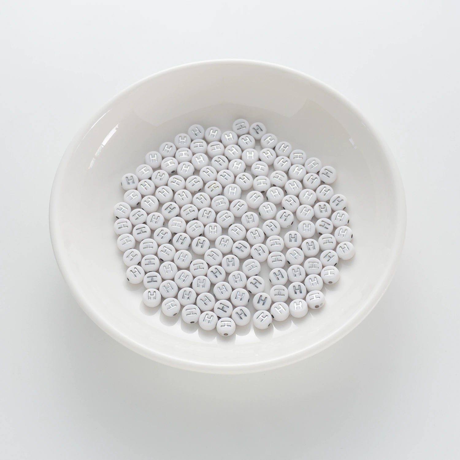 BW-00091-BD-01-silver-letter-white-opaque-coin-alphabet-beads-single-h-4×7mm