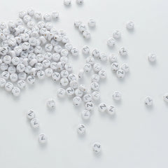 BW-00109-BD-04-silver-letter-white-opaque-coin-alphabet-beads-single-z-4×7mm