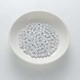 BW-00110-BD-01-silver-letter-white-opaque-coin-vowel-alphabet-beads-mix-4×7mm