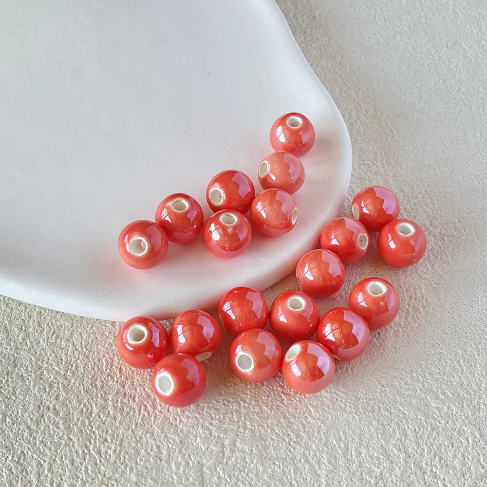 BD00014-02-creamy-blush-pink-round-ceramic-beads-10mm