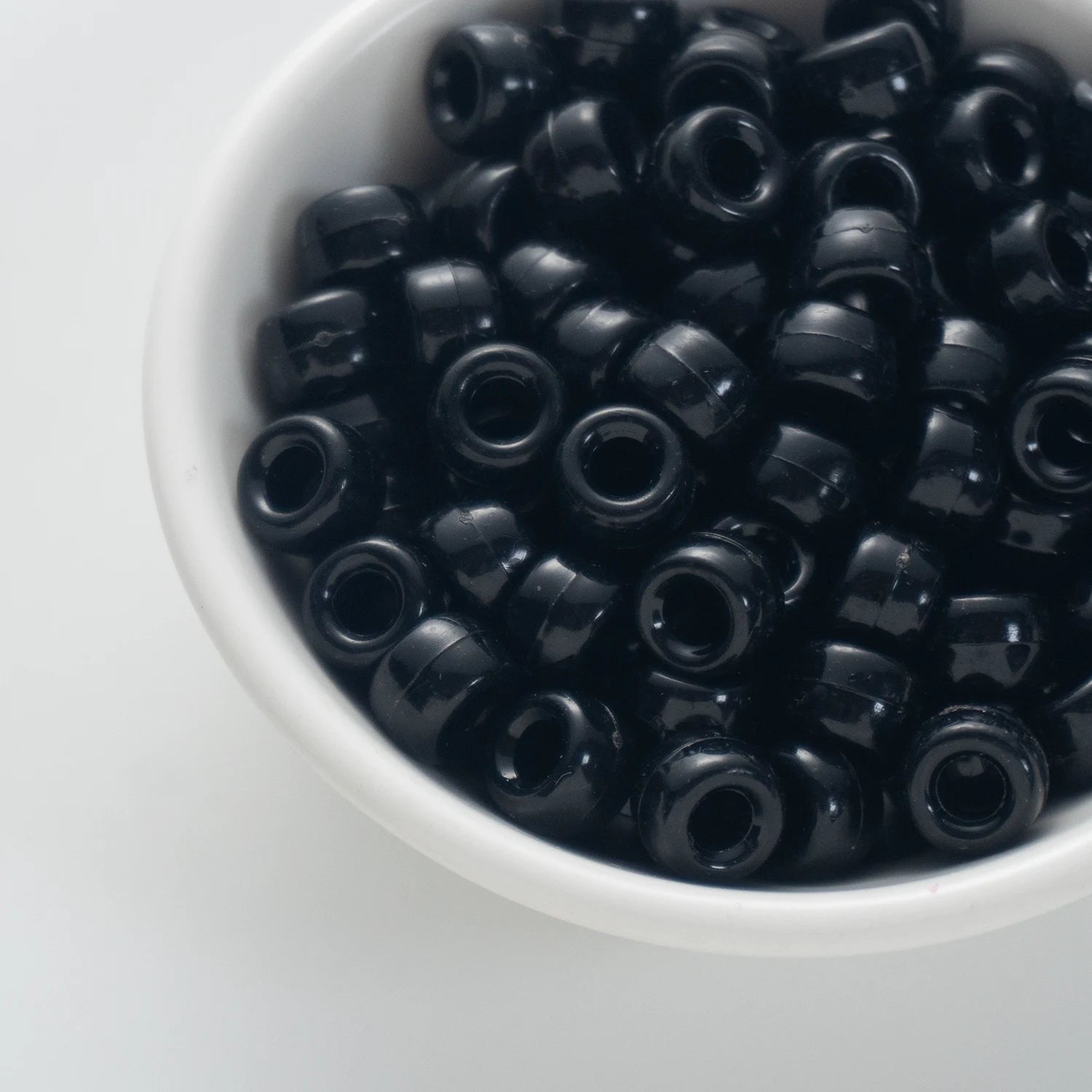 BD00048-02-pure-black-barrel-opaque-pony-beads-6×9mm