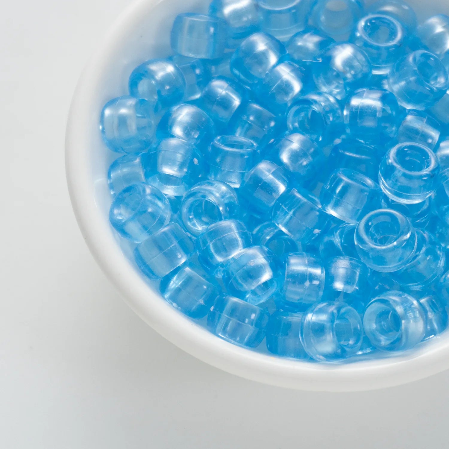 BD00070-02-baby-blue-barrel-transparent-pony-beads-6×9mm