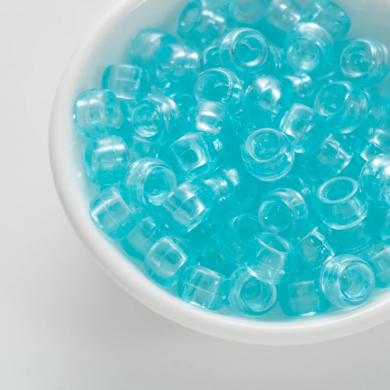 BD00071-02-celeste-blue-barrel-transparent-pony-beads-6×9mm