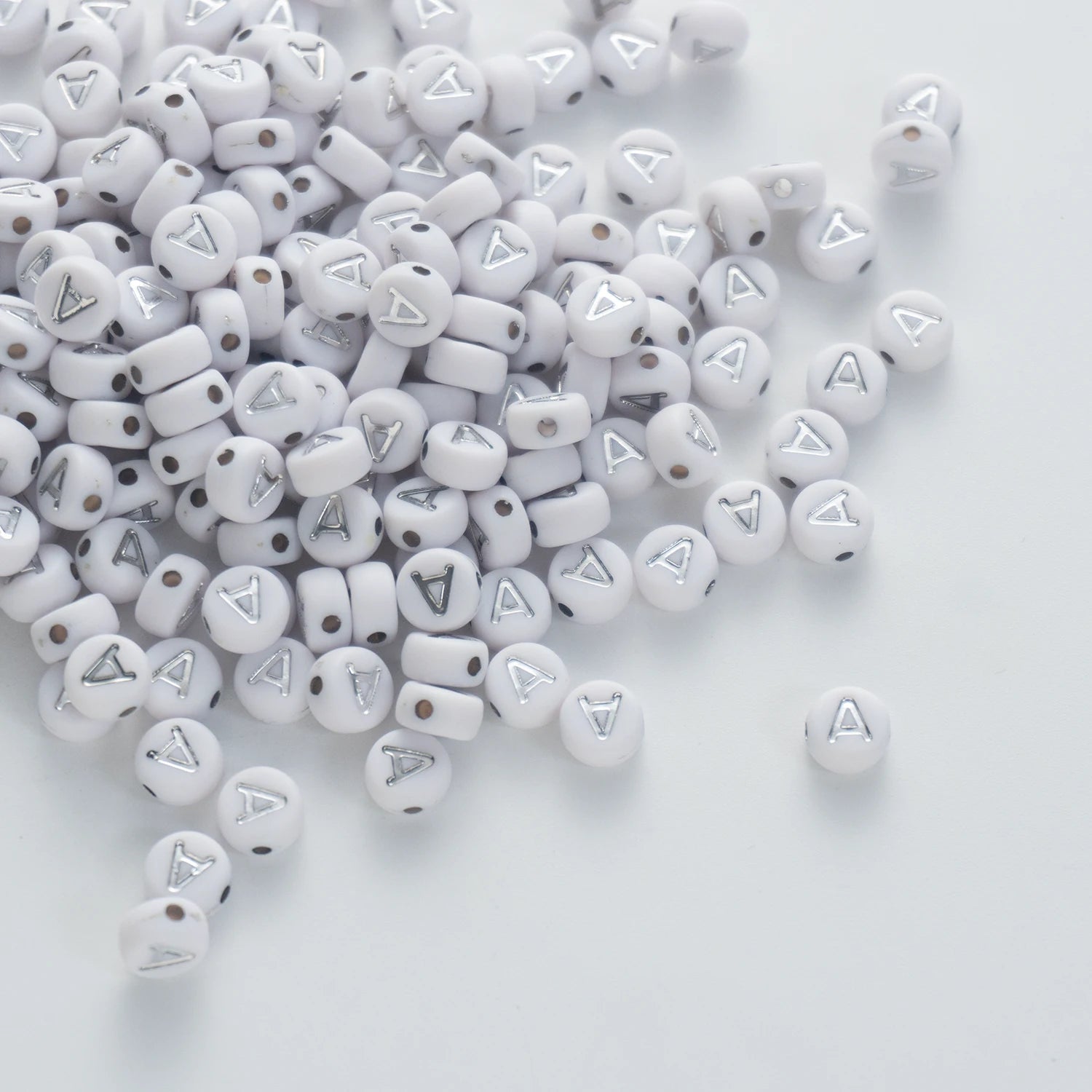 BD00084-03-silver-letter-white-opaque-coin-alphabet-beads-single-a-4×7mm